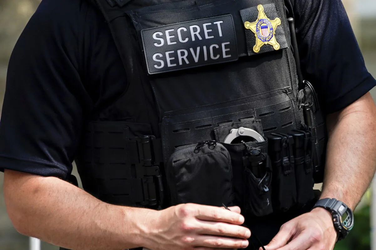 A secret service agent is stationed outside the funeral of Ivana Trump, Wednesday, July 20, 2022, in New York. The U.S. Secret Service recovered $286 million in fraudulently obtained pandemic funds to the Small Business Administration, Friday, Aug. 26. (AP Photo/Julia Nikhinson, File)