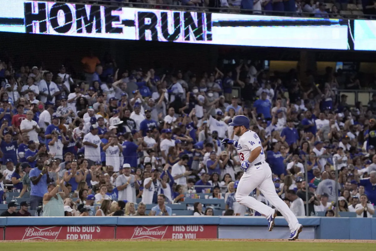 Los Angeles Dodgers' Max Muncy rounds third after hitting a solo home run during the second inning of a baseball game against the Minnesota Twins in Los Angeles, Aug. 10, 2022. (Mark J. Terrill/AP Photo)