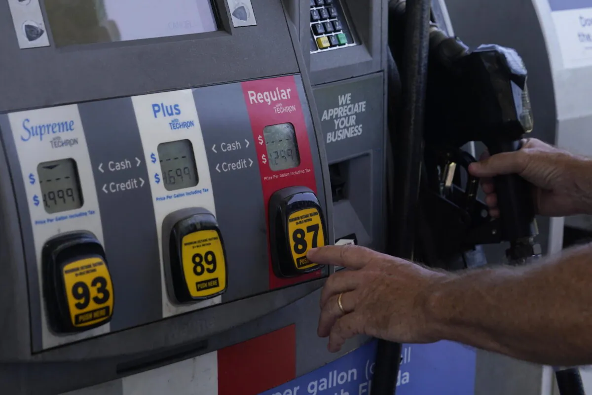 A customer pumps gas at an Exxon gas station in Miami, Fla., on May 10, 2022, in Miami. (AP Photo/Marta Lavandier)