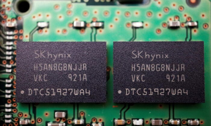 Memory chips by South Korean semiconductor supplier SK Hynix are seen on a circuit board of a computer, on Feb. 25, 2022. (Reuters/Florence Lo/Illustration/File Photo)
