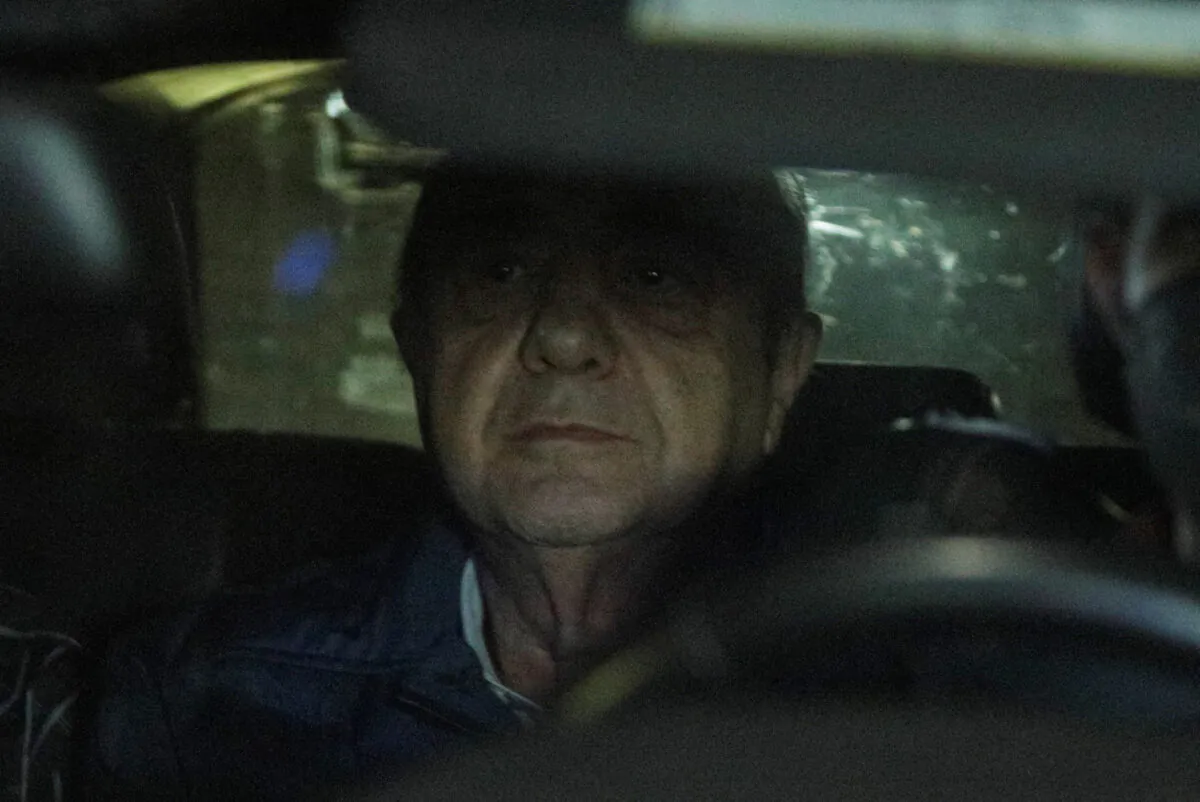 Former attorney general Jesus Murillo sits in a car as he is being held following his arrest in Mexico City on Aug. 20, 2022. (Luis Cortes/Reuters)