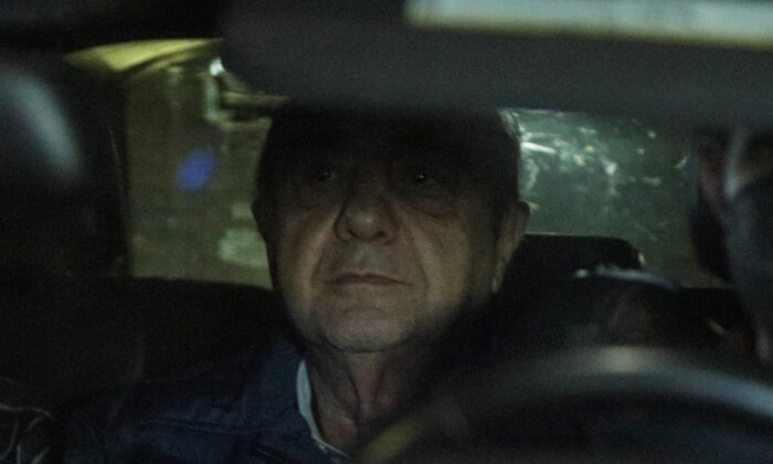 Former attorney general Jesus Murillo sits in a car as he is being held following his arrest in Mexico City on Aug. 20, 2022. (Luis Cortes/Reuters)
