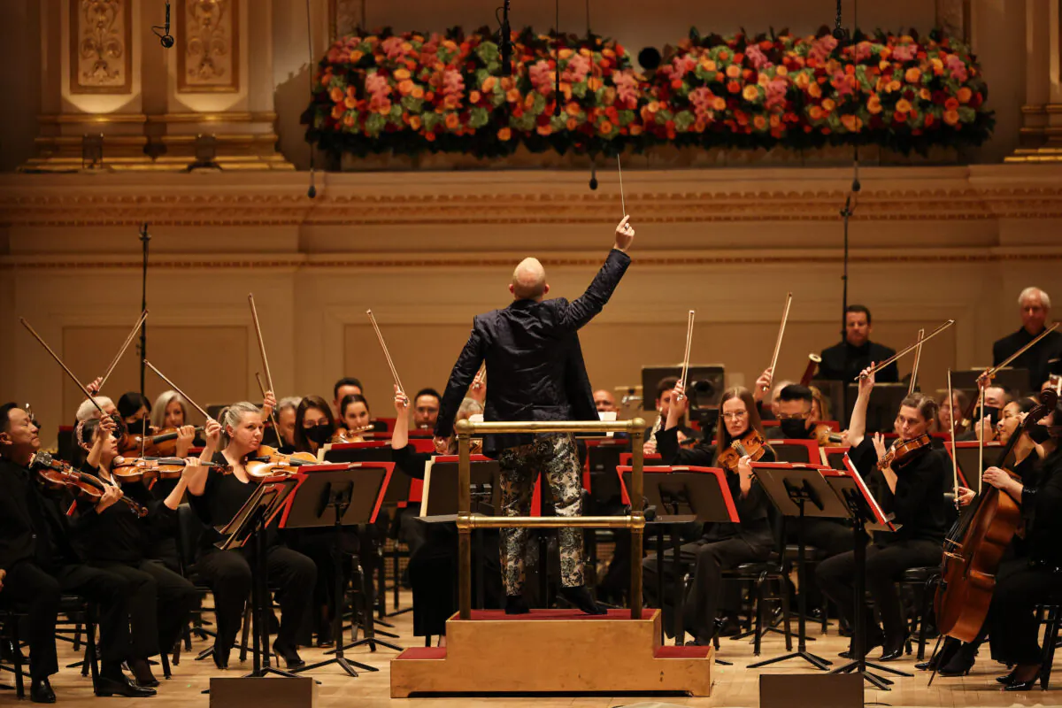 Yannick Nézet-Séguin, music director of the Philadelphia Orchestra, conducts a performance Valerie Coleman's "Seven O’Clock Shout," an anthem that honors frontline workers in response to coronavirus (COVID-19) pandemic during opening night at the Stern Auditorium at Carnegie Hall in New York City on Oct. 6, 2021. (Michael M. Santiago/Getty Images)