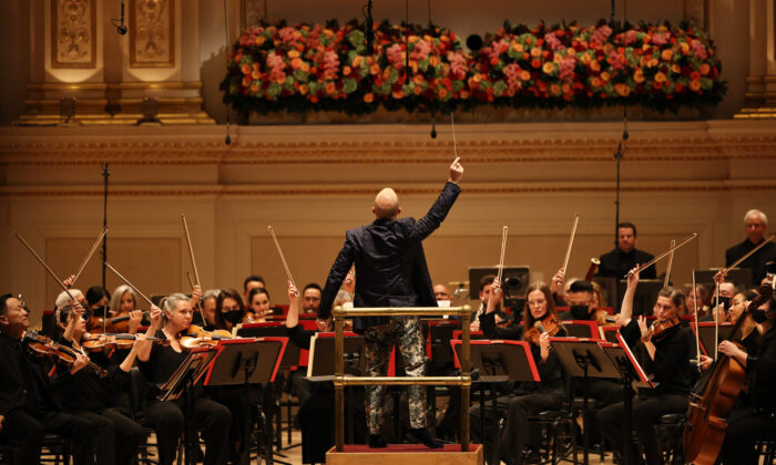 Yannick Nézet-Séguin, music director of the Philadelphia Orchestra, conducts a performance Valerie Coleman's "Seven O’Clock Shout," an anthem that honors frontline workers in response to coronavirus (COVID-19) pandemic during opening night at the Stern Auditorium at Carnegie Hall in New York City, on Oct. 06, 2021. (Michael M. Santiago/Getty Images)