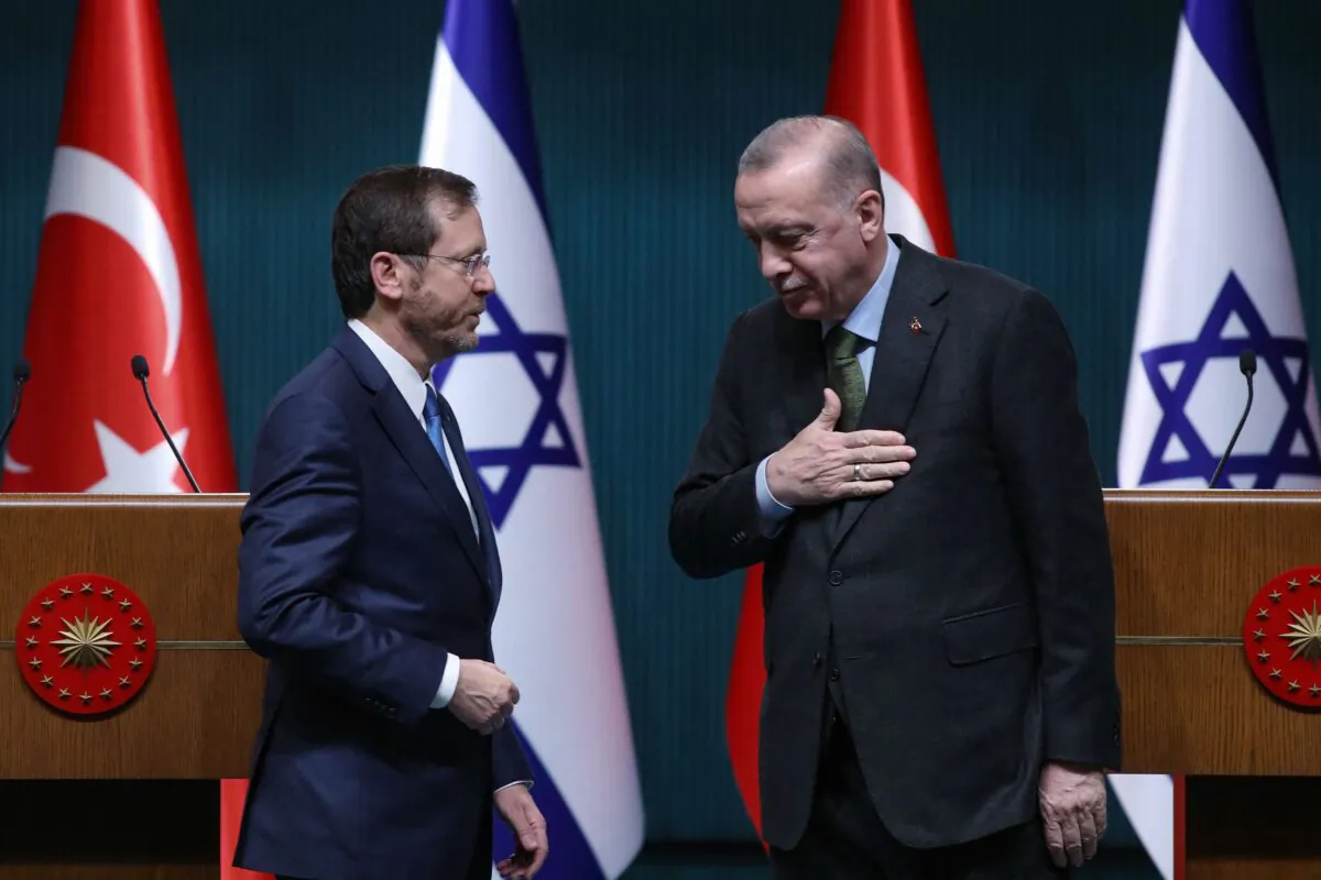 Israeli President Isaac Herzog (L) stands next to his Turkish counterpart, Tayyip Erdogan, after a press conference in Ankara, Turkey, on March 9, 2022. (STR/AFP via Getty Images)