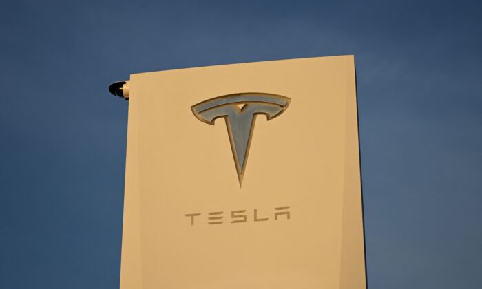 The Tesla Inc. logo is displayed on a sign outside the Tesla Design Center in Hawthorne, Calif., on Aug. 9, 2022. (Patrick T. Fallon/AFP via Getty Images)
