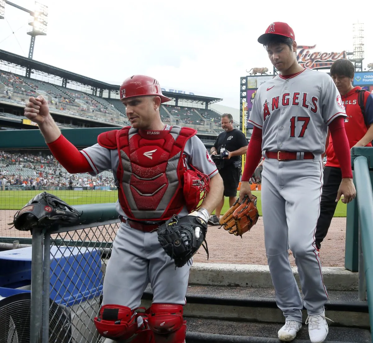 Shohei Ohtani #17 and catcher Max Stassi #33 of the Los Angeles Angels walk into the dugout before a game against the Detroit Tigers at Comerica Park in Detroit, on August 21, 2022. (Duane Burleson/Getty Images)