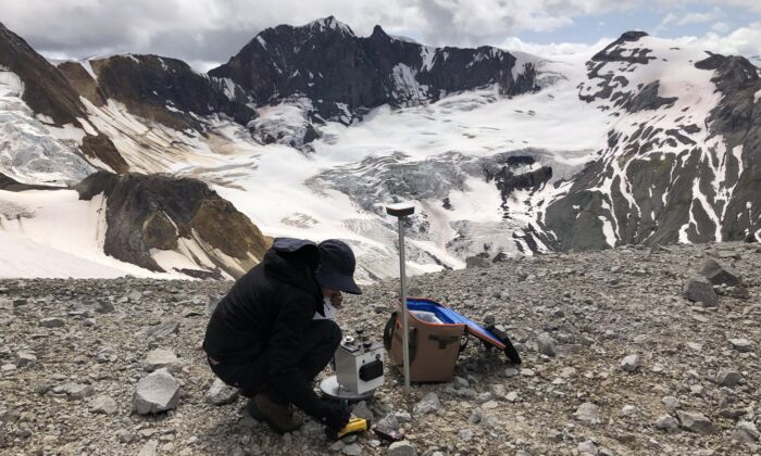 Geologist Antonina Calahorrano sets up a test well to map the region's geothermal possibilities. (The Canadian Press/HO/Natural Resources Canada)