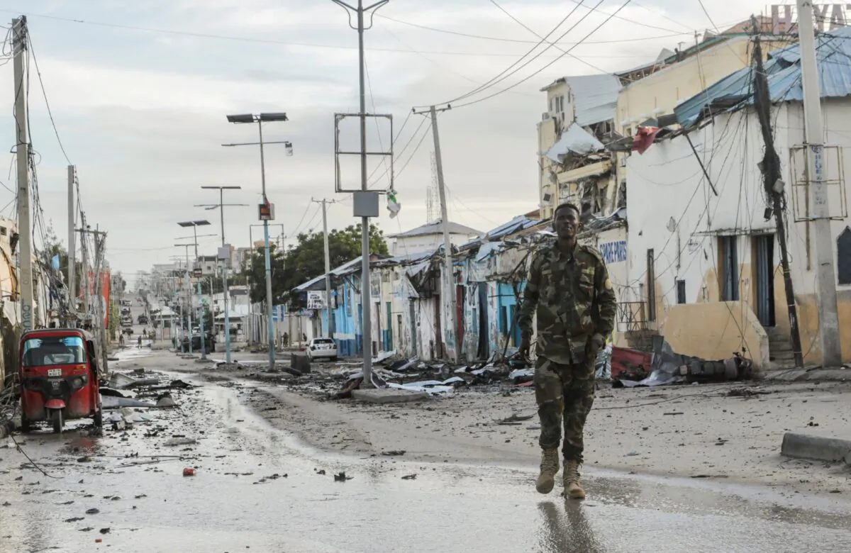 A Somali security officer walks past a section of Hotel Hayat, the scene of an al-Qaeda-linked al Shabaab terrorist attack in Mogadishu, Somalia, on Aug. 20, 2022. (Feisal Omar/Reuters)