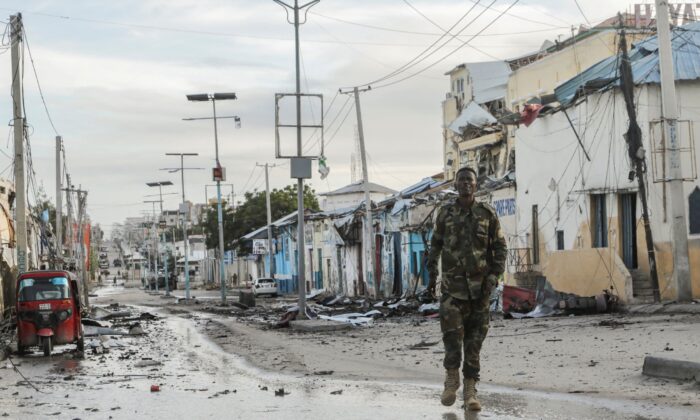 A Somali security officer walks past a section of Hotel Hayat, the scene of an al-Qaeda-linked al Shabaab terrorist attack in Mogadishu, Somalia, on Aug. 20, 2022. (Feisal Omar/Reuters)