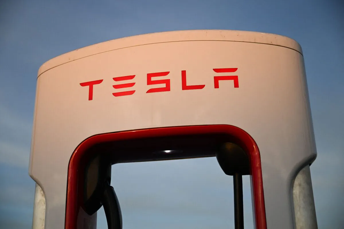 The Tesla electric vehicle logo is displayed on a charging bay at a supercharger location in Hawthorne, California, on Aug. 9, 2022. (Patrick T. Fallon/AFP via Getty Images)