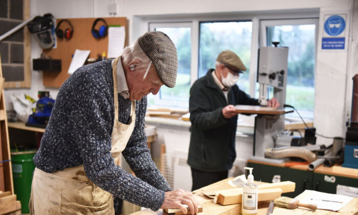 Members from Yorks Men's Shed attend their weekly meeting as they work on joinery projects in York, England, on Dec. 14, 2021. (Nathan Stirk/Getty Images)