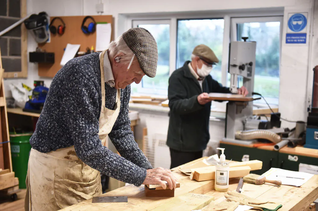 Members from Yorks Men's Shed attend their weekly meeting as they work on joinery projects in York, England, on Dec. 14, 2021. (Nathan Stirk/Getty Images)