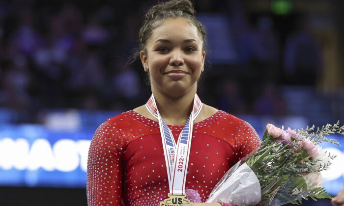 Konnor McClain receives the gold medal after finishing in first place overall during the U.S. Gymnastics Championships in Tampa, Fla., Aug. 21, 2022. (Mike Carlson/AP Photo)