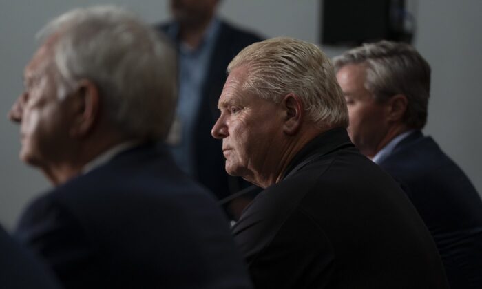 Ontario Premier Doug Ford, centre, attends a press conference with New Brunswick Premier Blaine Higgs, left, and Nova Scotia Premier Tim Houston following a meeting with the Maritime premiers in Moncton, N.B., on Aug. 22, 2022. (The Canadian Press/Darren Calabrese)