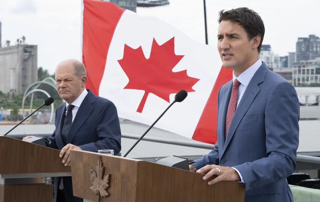 Prime Minister Justin Trudeau responds to a question next to German Chancellor Olaf Scholz during a news conference in Montreal on Aug. 22, 2022. (The Canadian Press/Paul Chiasson)
