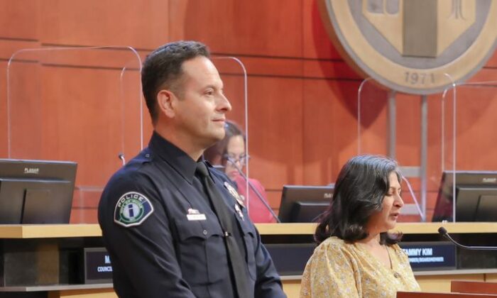 Irvine Mayor Farrah Khan grants Officer Alex Mendoza an award for Drug Abuse Resistance Education international officer of the year in Irvine, Calif., on Aug. 9, 2022. (Courtesy of the Irvine Police Department)