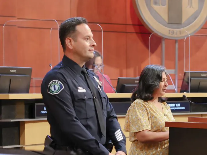 Irvine Mayor Farrah Khan grants Officer Alex Mendoza an award for Drug Abuse Resistance Education international officer of the year in Irvine, Calif., on Aug. 9, 2022. (Courtesy of the Irvine Police Department)