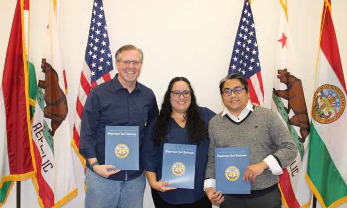 (L-R) Angels Executive Director Jeff Weimann and resource parents Rae’ah and Max Maningas receive recognition from Supervisor Joel Anderson in San Diego. (Courtesy of San Diego Supervisor Joel Anderson’s office).