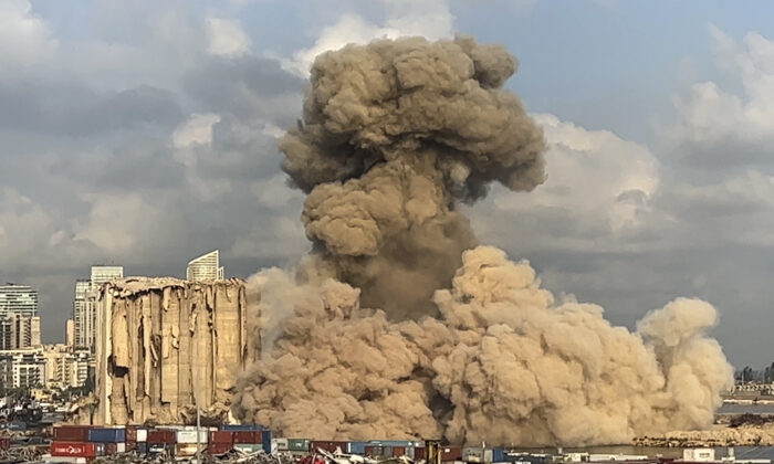 Smoke and dust are rising from collapsing silos damaged during the August 2020 massive explosion in the port in Beirut on Aug. 23, 2022, in this image from a video. (Lujain Jo/AP Photo)