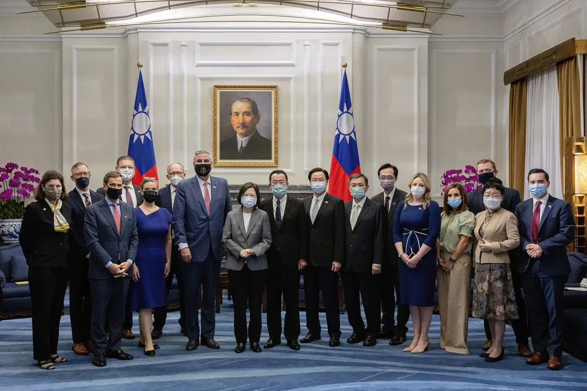 Taiwan's President Tsai Ing-wen poses for photos with a delegation led by U.S. Indiana Governor Eric Holcomb during a meeting at the Presidential office in Taipei, Taiwan, on Aug 22, 2022. (Taiwan Presidential Office via AP)