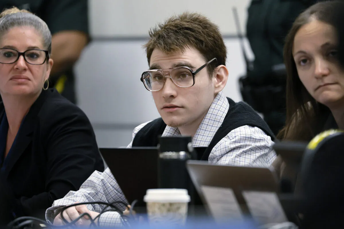 Marjory Stoneman Douglas High School shooter Nikolas Cruz watches as Assistant Public Defender Melisa McNeill gives the defense's opening statement during the penalty phase of his trial at the Broward County Courthouse in Fort Lauderdale, Fla., on Aug. 22, 2022. (Amy Beth Bennett/South Florida Sun Sentinel via AP, Pool)