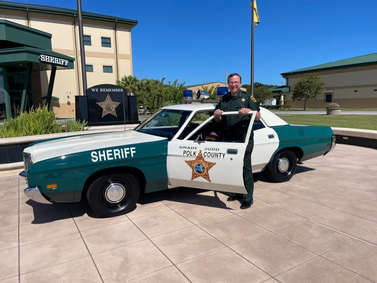 Polk County Sheriff Grady Judd poses in front of a replica of his 1972 Ford Galaxie; the same model and year of his first police cruiser when he began his career in law enforcement. Image taken on Aug. 19, 2022. (Courtesy of Polk County Sheriff's Office)