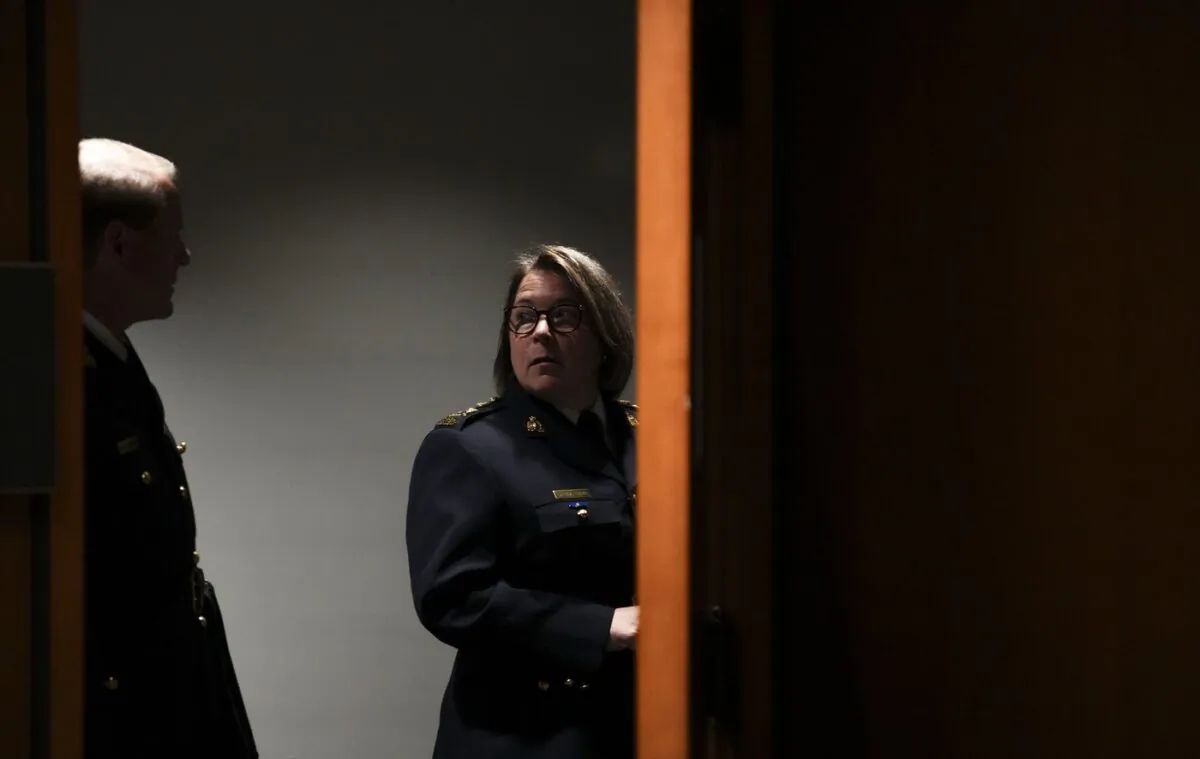 RCMP Commissioner Brenda Lucki and deputy commissioner Brian Brennan wait to appear as a witnesses at the Standing Committee on Public Safety and National Security on Parliament Hill, in Ottawa, on July 25, 2022. (The Canadian Press/Sean Kilpatrick)