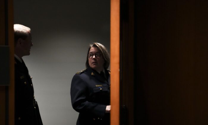 RCMP Commissioner Brenda Lucki and deputy commissioner Brian Brennan wait to appear as a witnesses at the Standing Committee on Public Safety and National Security on Parliament Hill, in Ottawa, on July 25, 2022. (The Canadian Press/Sean Kilpatrick)