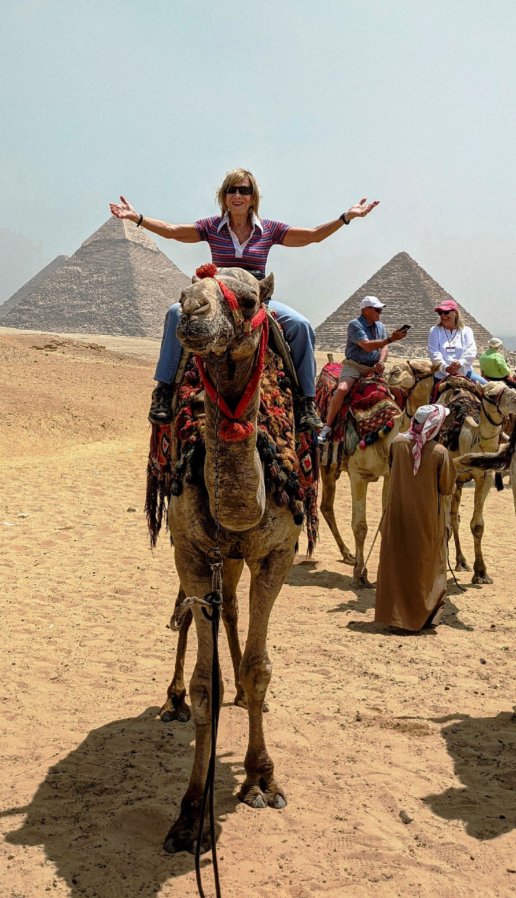 The author rides a camel at the Pyramids of Giza in Egypt.