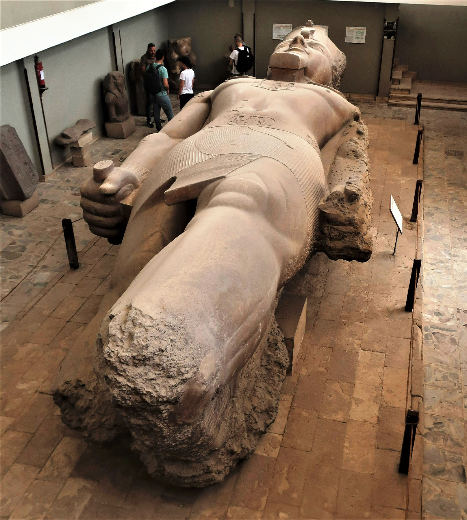 A fallen statue of Ramses II reposes in Memphis, Egypt.