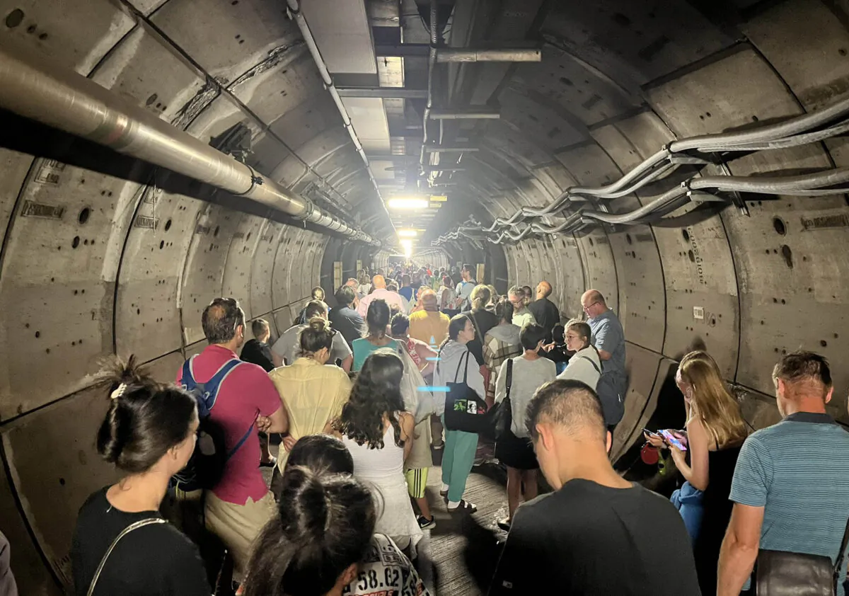 Passengers in an emergency tunnel after a train broke down down beneath the English Channel on Aug. 23, 2022. (Kate Scott/Twitter/PA)