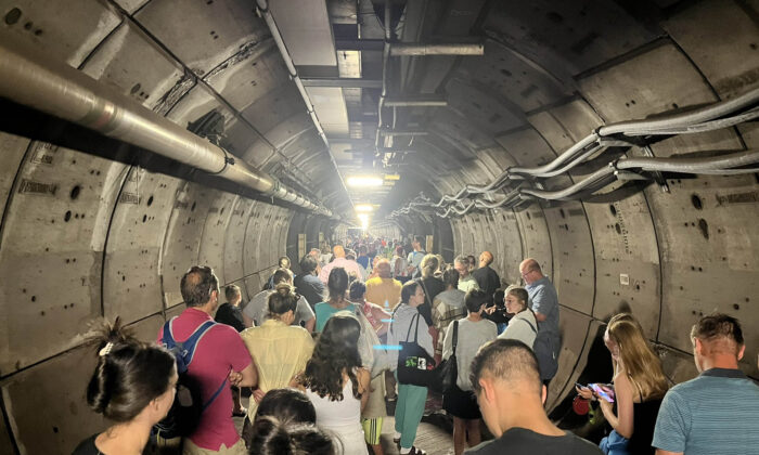 Passengers in an emergency tunnel after a train broke down down beneath the English Channel on Aug. 23, 2022. (Kate Scott/Twitter/PA)