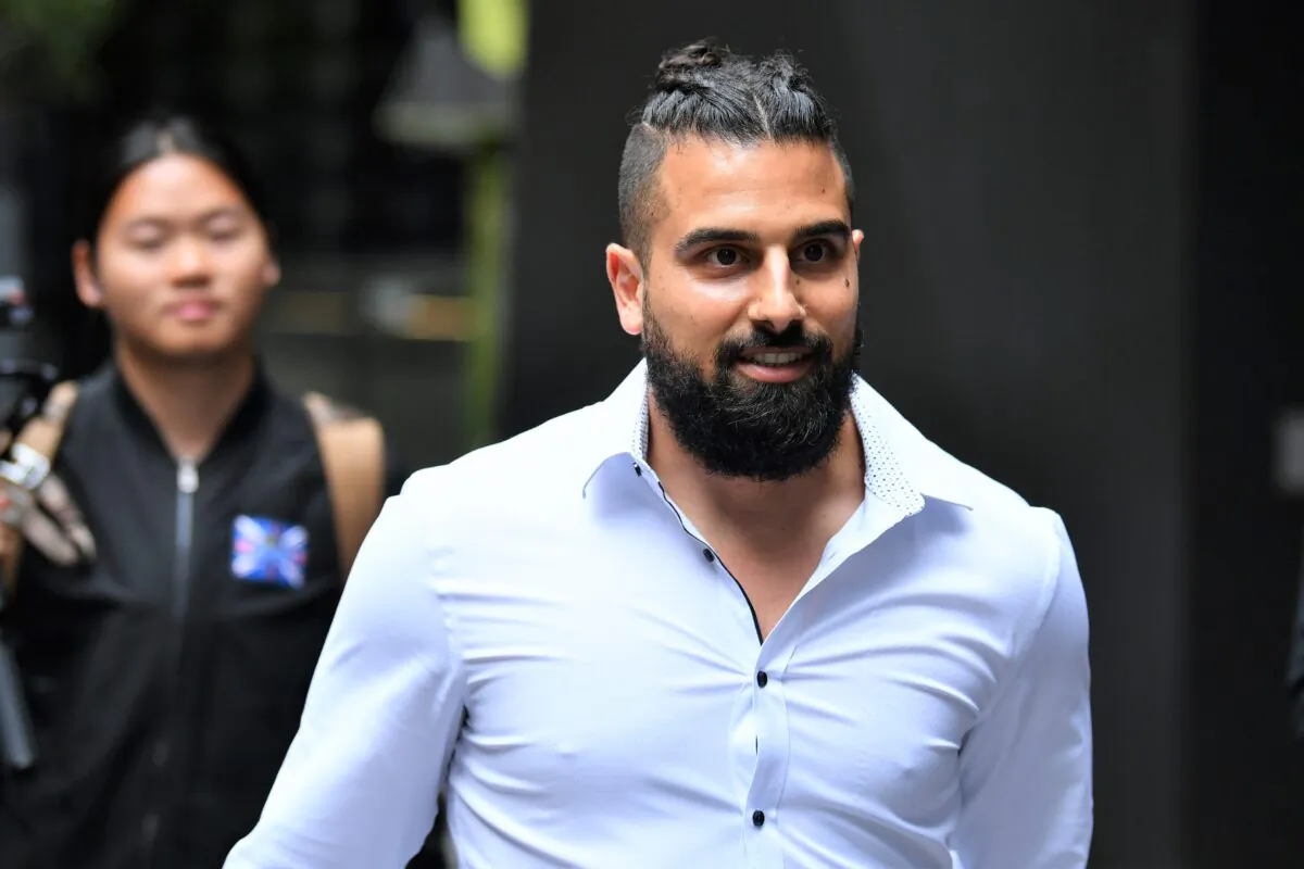 Avi Yemini leaves the Supreme Court of Victoria in Melbourne, Australia, on March 16, 2022. (AAP Image/Joel Carrett)