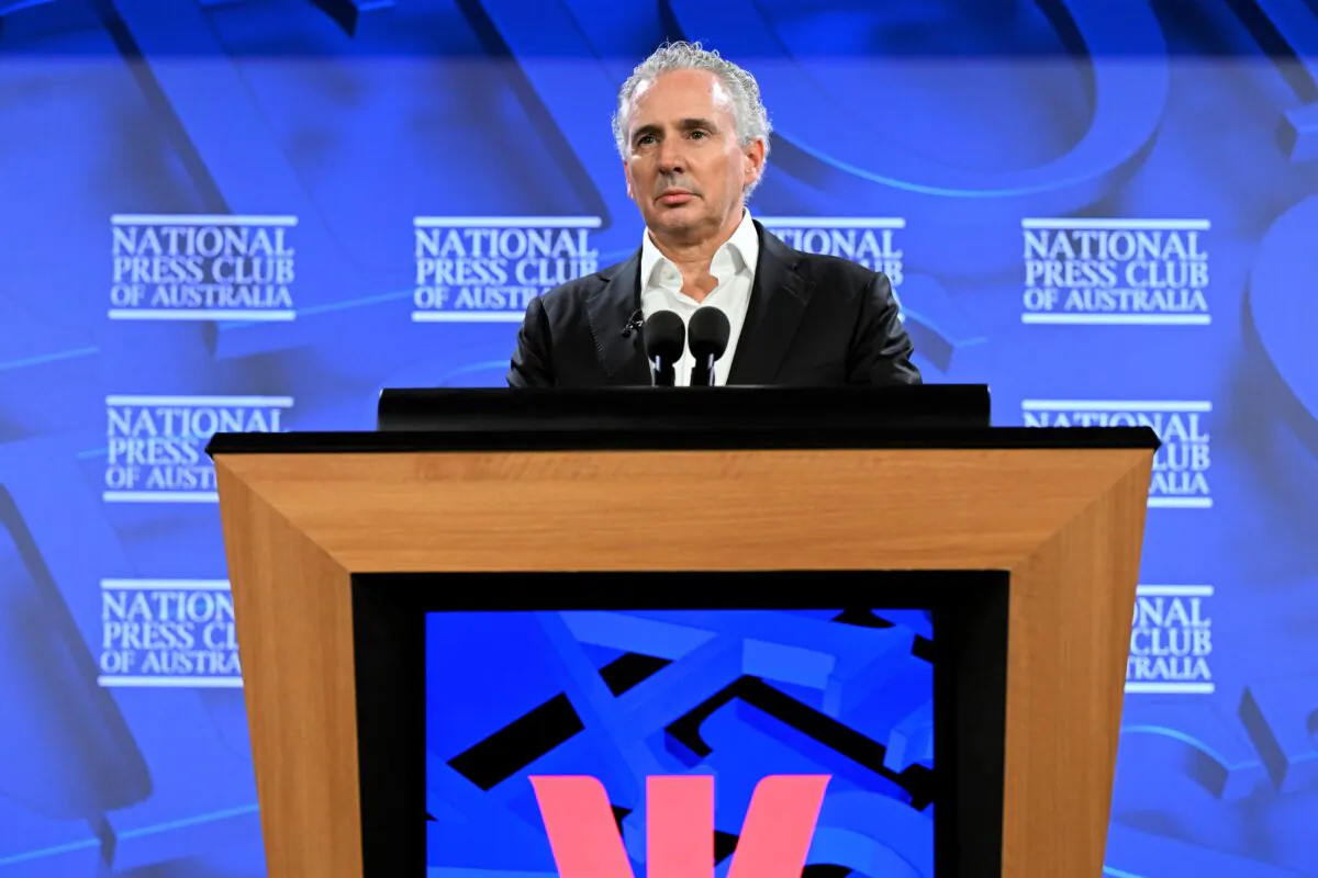 Cyber Industry Advisory Committee chair and Telstra CEO Andy Penn addresses the National Press Club in Canberra, Australia, on Aug. 23, 2022. (AAP Image/Lukas Coch)
