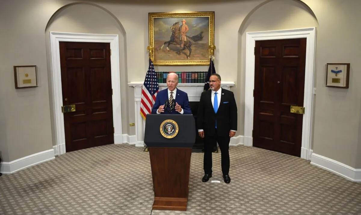 President Joe Biden announces student loan relief with Education Secretary Miguel Cardona in the Roosevelt Room of the White House on Aug. 24, 2022. (Olivier Douliery/AFP via Getty Images)