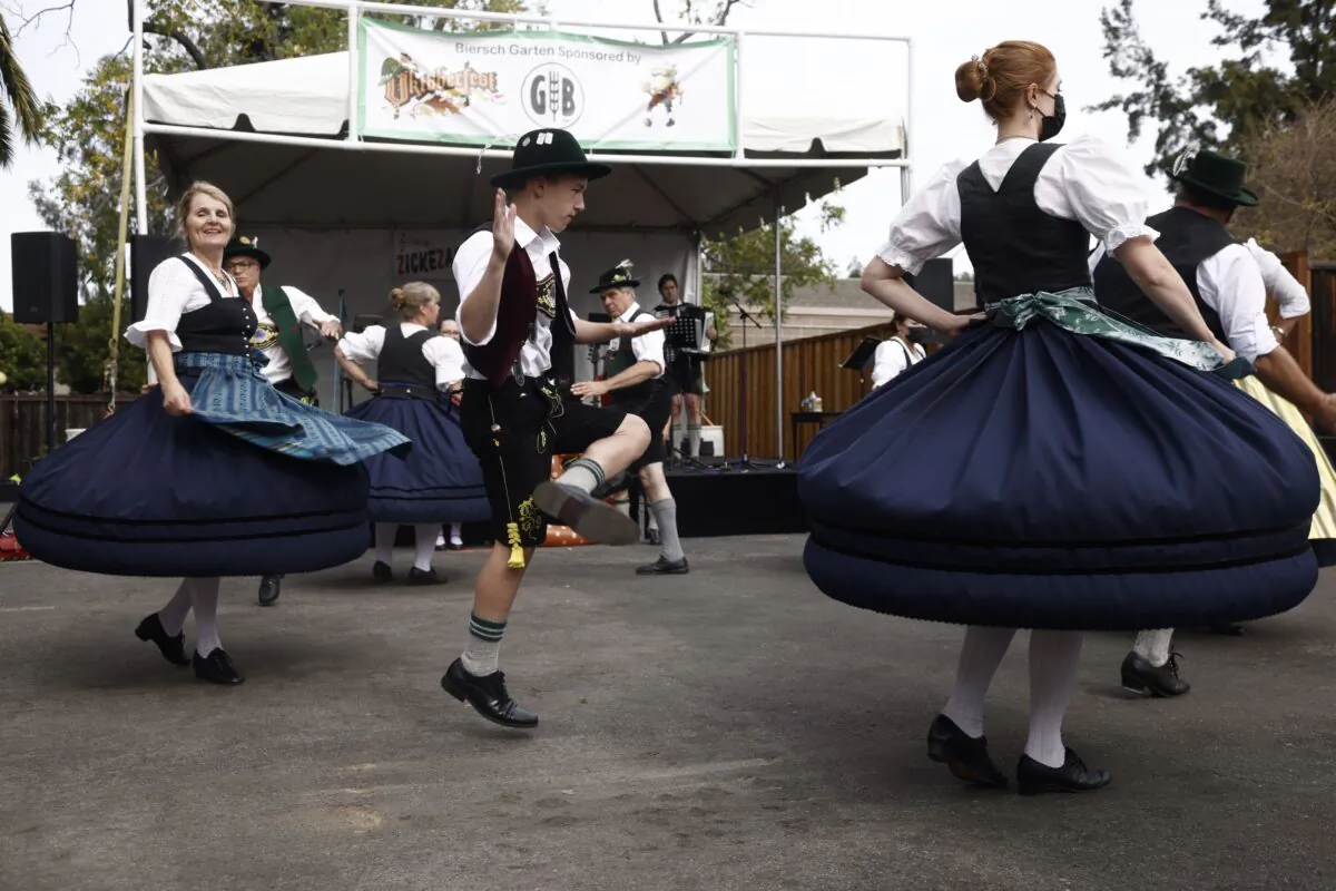 CAMPBELL, CALIFORNIA - OCTOBER 17: Willi Schwaegerle dances with Andrea Edelhouser and the Golden Gate Bavarian Club at the 26th Annual Oktoberfest on East Campbell Avenue in Campbell, Calif., on Sunday, Oct. 17, 2021. (Shae Hammond/Bay Area News Group)