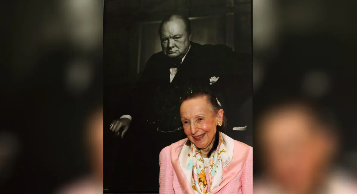 Estrellita Karsh wife of legenary photographer Yousuf Karsh stands in front of the iconic 1941 photograph of Winston Churchill taken by her husband in the Speaker of the House of Commons' chambers on July 14, 2009. (The Canadian Press/Fred Chartrand)