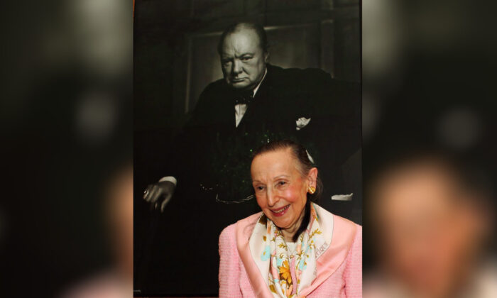 Estrellita Karsh wife of legenary photographer Yousuf Karsh stands in front of the iconic 1941 photograph of Winston Churchill taken by her husband in the Speaker of the House of Commons' chambers on July 14, 2009. (The Canadian Press/Fred Chartrand)