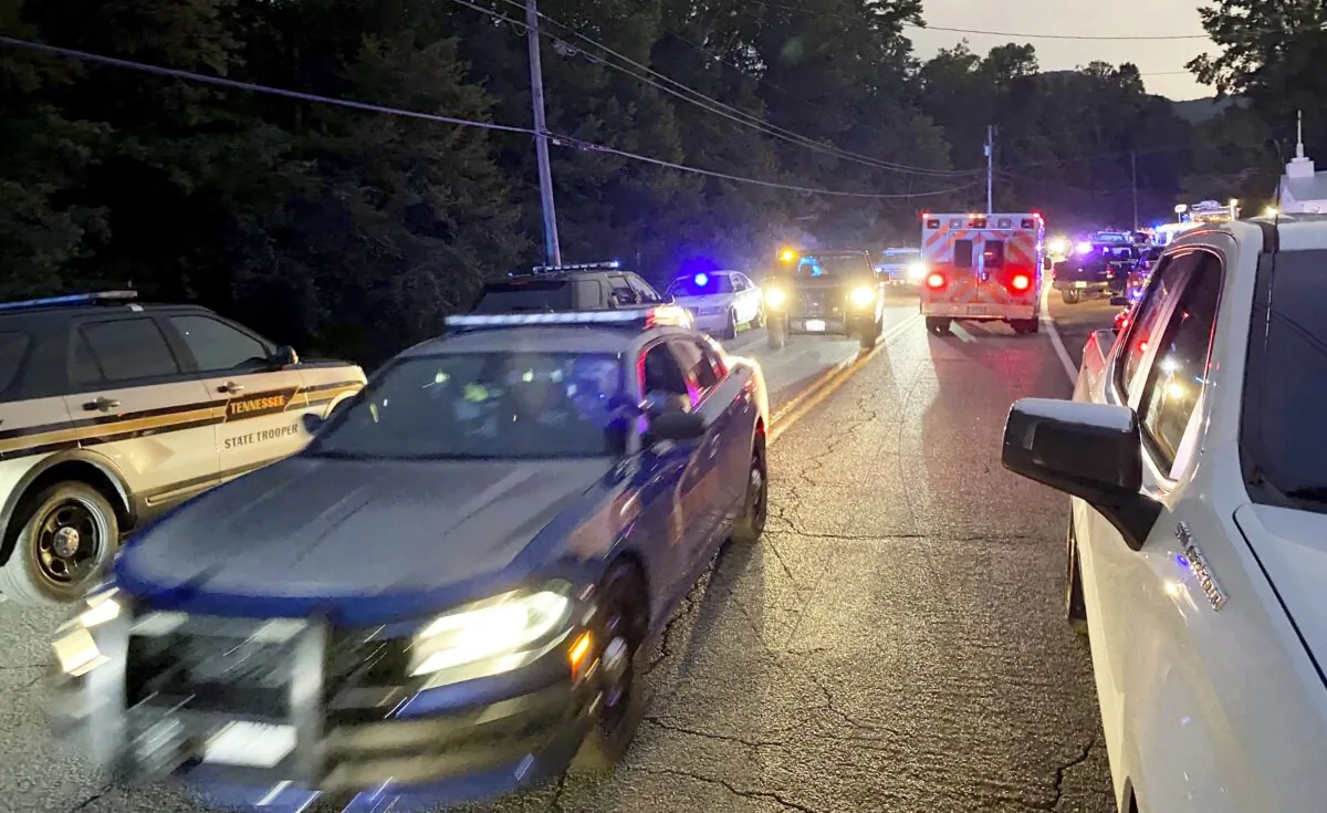 Officials prepare for a news conference in Whiteside, Tenn., where a Tennessee Highway Patrol helicopter had crashed, on Aug. 23, 2022. (Carmen Nesbitt/Chattanooga Times Free Press via AP)