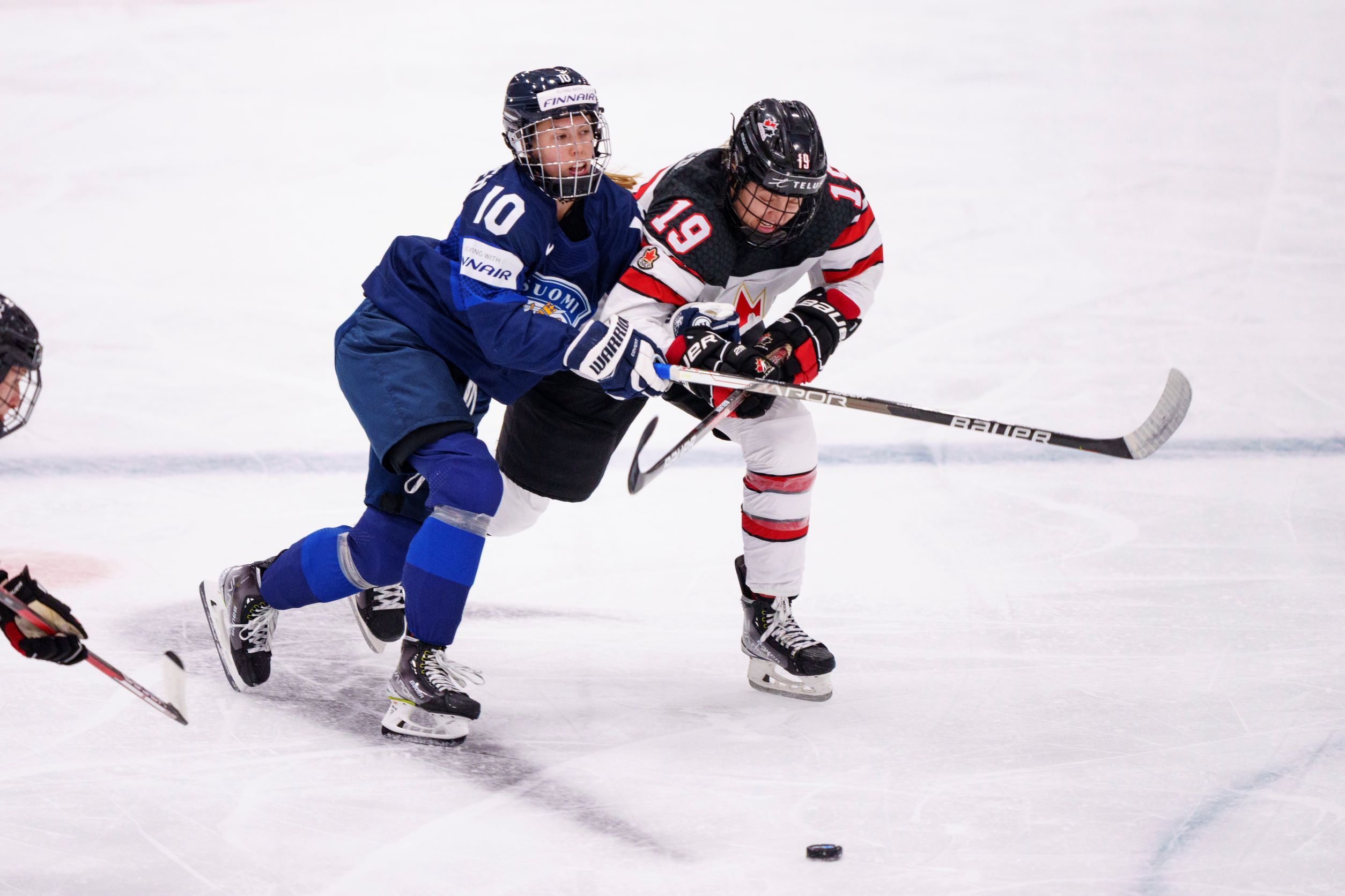 Elisa Holopainen of Finland in action with Brianne Jenner of Canada