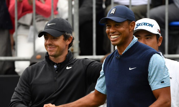 Tiger Woods of the US (R) shakes hands with Rory McIlroy of Northern Ireland (L) at the first hole tee at a "Japan Skins" pre-match ahead of the ZOZO Championship golf tournament at the Narashino Country Club in Inzai, Chiba prefecture on October 21, 2019. (Photo by Toshifumi KITAMURA / AFP) (Photo by TOSHIFUMI KITAMURA/AFP via Getty Images)