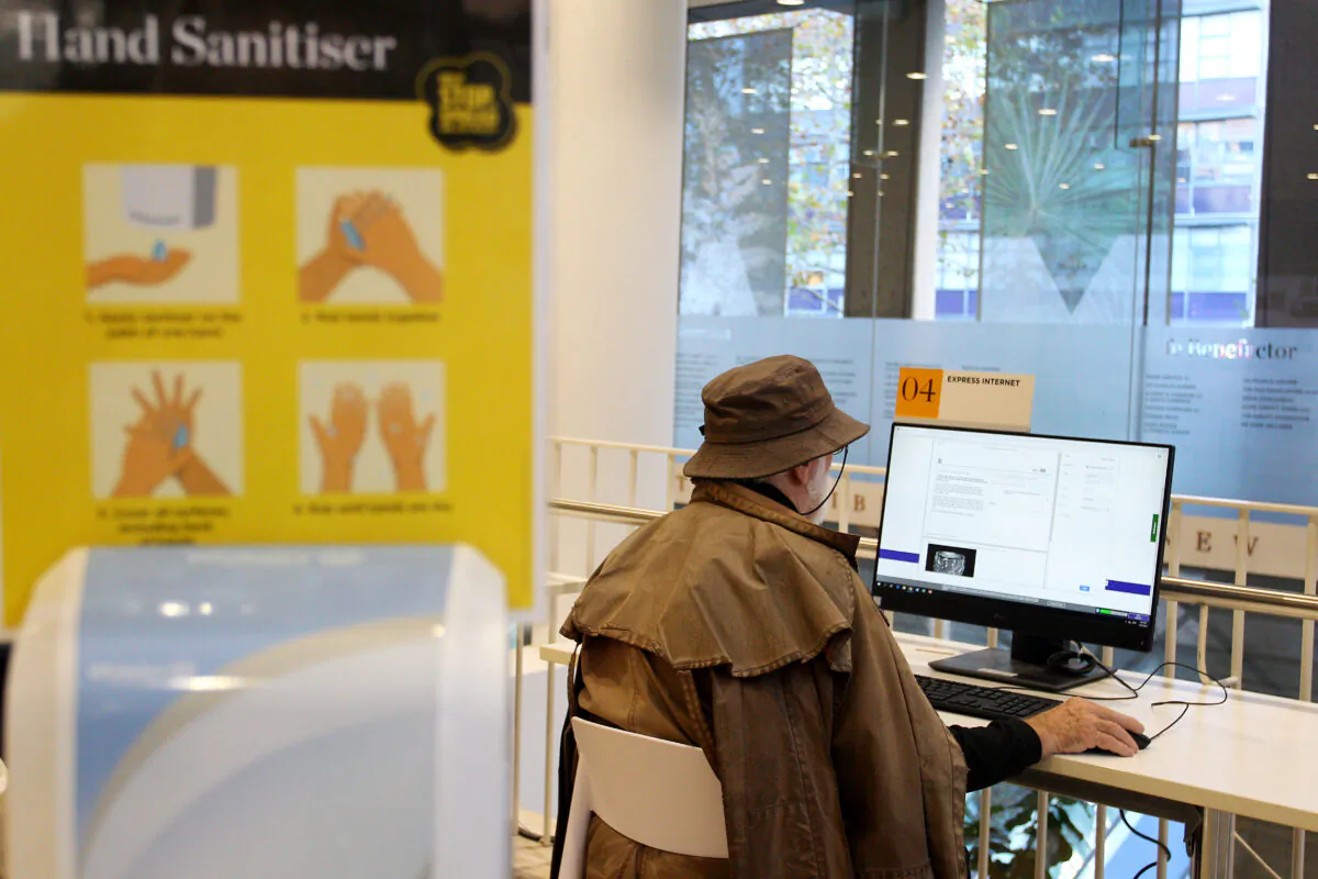 A man works at a computer station at the State Library of New South Wales in Sydney, Australia, on June 1, 2020. (Lisa Maree Williams/Getty Images)