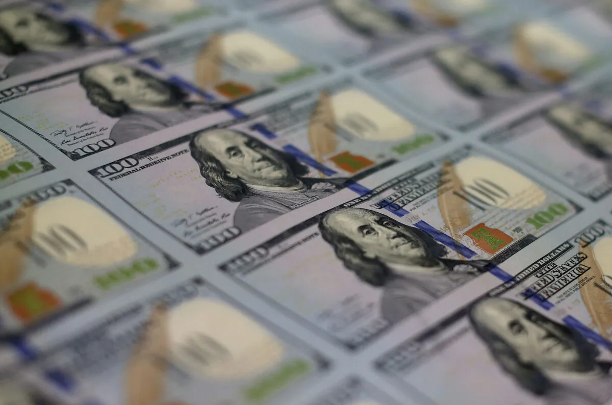 Newly redesigned $100 notes lay in stacks at the Bureau of Engraving and Printing in Washington on May 20, 2013. (Mark Wilson/Getty Images)