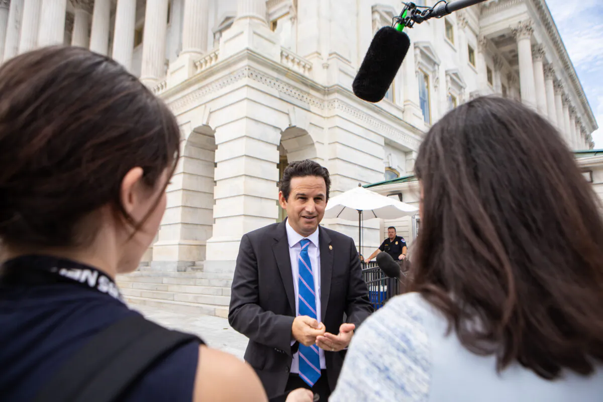 Sen. Brian Schatz (D-Hawaii) speaks to reporters about the Inflation Reduction Act outside of the U.S. Capitol in Washington on Aug. 6, 2022. (Anna Rose Layden/Getty Images)