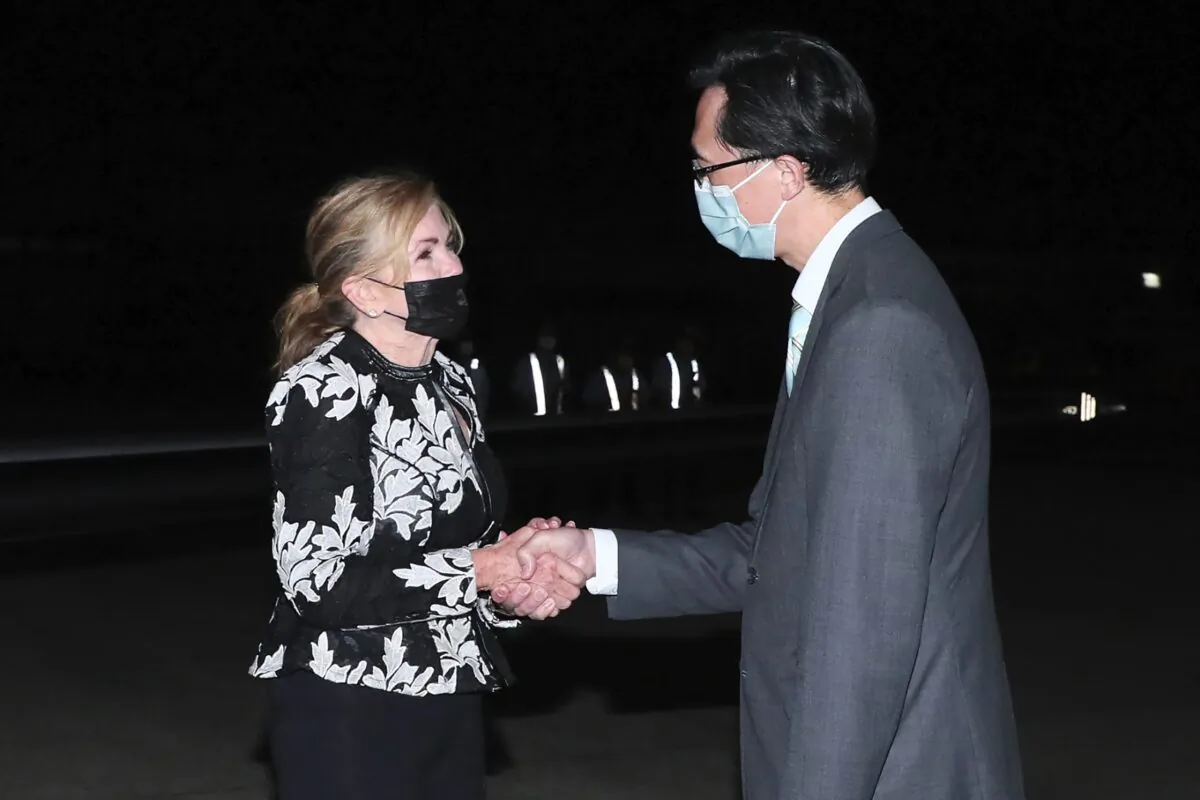U.S. Sen. Marsha Blackburn (R-Tenn) is greeted by Douglas Yu-Tien Hsu (R), Director-General, Taiwan's dept. of North American Affairs, as she arrives on a plane in Taipei, Taiwan, on Aug. 25, 2022. (Taiwan Ministry of Foreign Affairs via AP)