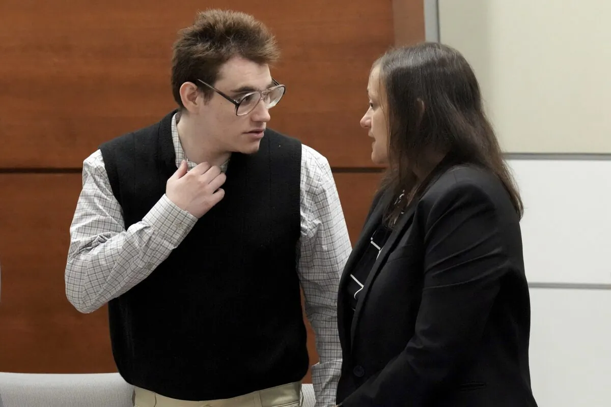 Marjory Stoneman Douglas High School shooter Nikolas Cruz speaks with sentence mitigation specialist Kate O'Shea, a member of the defense team, during the penalty phase of Cruz's trial at the Broward County Courthouse in Fort Lauderdale, Fla., on Aug. 25, 2022. (Amy Beth Bennett/South Florida Sun Sentinel via AP, Pool)