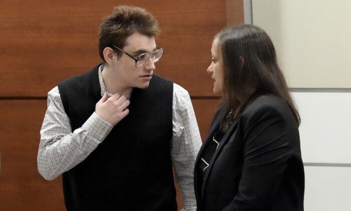 Marjory Stoneman Douglas High School shooter Nikolas Cruz speaks with sentence mitigation specialist Kate O'Shea, a member of the defense team, during the penalty phase of Cruz's trial at the Broward County Courthouse in Fort Lauderdale, Fla., on Aug. 25, 2022. (Amy Beth Bennett/South Florida Sun Sentinel via AP, Pool)