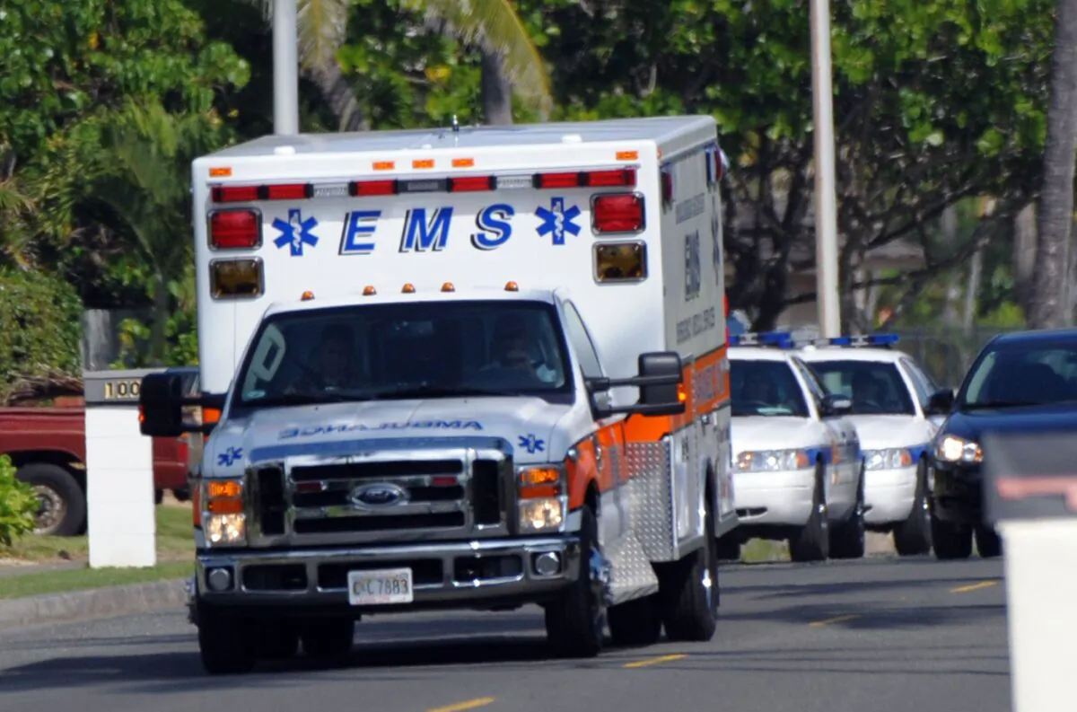 An ambulance and police in Hawaii on Dec. 28, 2009. (Jewel Samad/AFP via Getty Images)