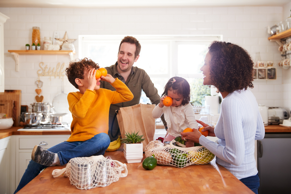 The kitchen counter is often a family gathering place. (Monkey Business Images/Shutterstock)